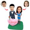 Figuras Cabezudo personalizadas con corazón rosa