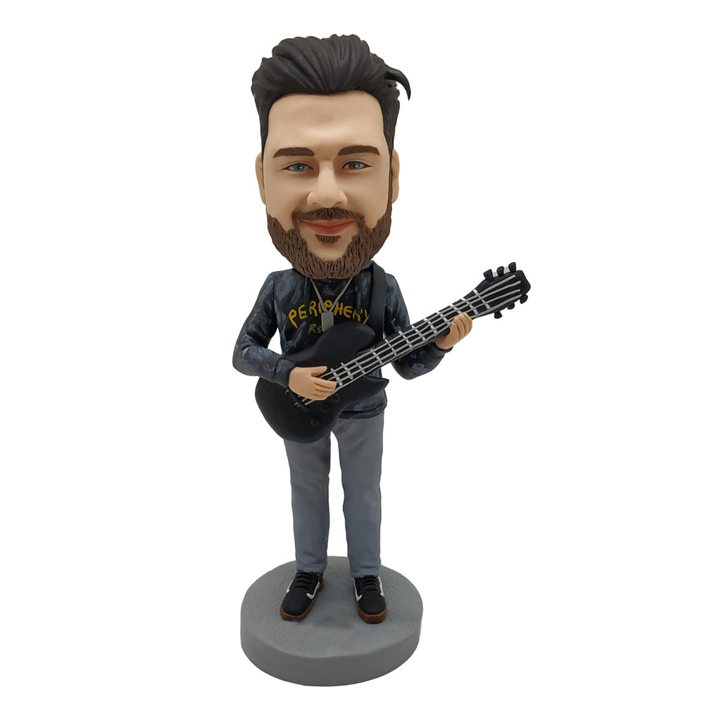Muñeco Cabezudo para amantes de la música con guitarra