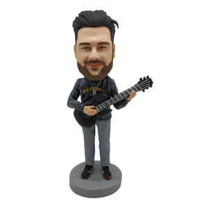 Muñeco Cabezudo para amantes de la música con guitarra