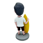 Cabezudo personalizado con tabla de surf