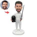 Figura cabezona personalizada de un esgrimista a partir de una foto.