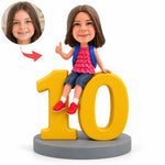 Figura bobblehead personalizada de niña sentada sobre el número 10, regalo de cumpleaños de 10 años
