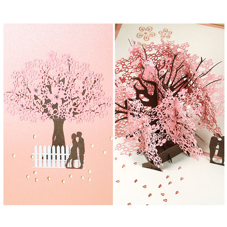 Tarjeta de felicitación emergente 3D de pareja romántica bajo el cerezo