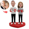 Cabezudo de pareja personalizado con “LOVE”