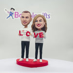 Cabezudo de pareja personalizado con “LOVE”
