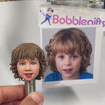 Cabezudo de niño personalizado con juguete
